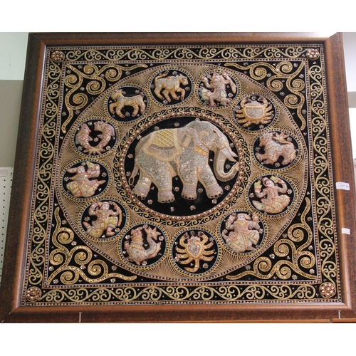 85 - An Eastern style woven silk embroidered panel with central elephant motif, framed