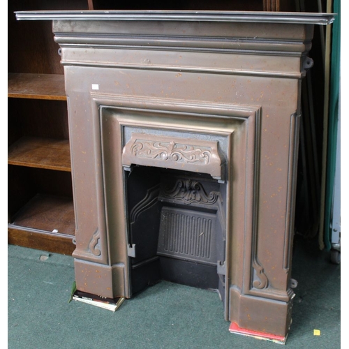 94 - A modern cast iron art nouveau style fireplace with back