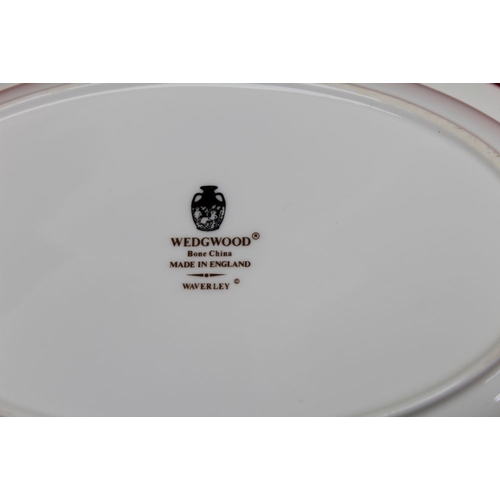 104 - A Wedgwood Waverley dinner service containing; 8 x 27cm dia plates, 8 x 20cm dia plates, 8 x 17.5cm ... 