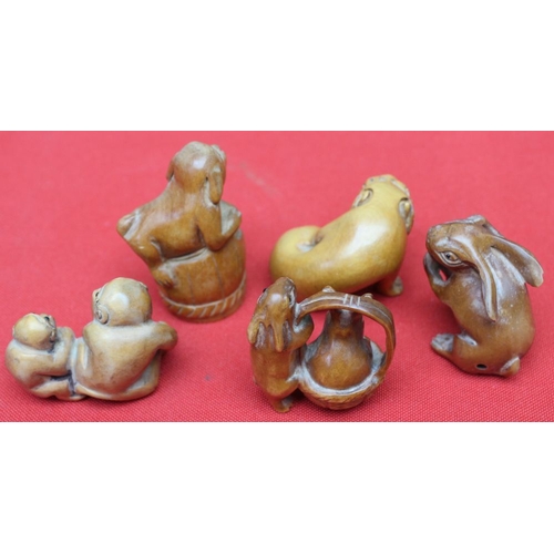 231 - A collection of five Japanese carved wood Netsuke, all as animals, includes Monkey's, Hare's, Temple... 