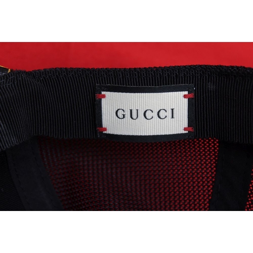 245 - A Gucci baseball cap (large) in Gucci carrier bag