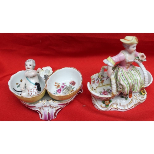 249 - Four 19th century porcelain salts, including a pair of Meissen ones, modelled as figures sat upon ba... 