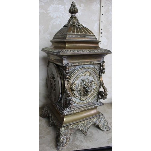 260 - An ornate cast brass cased mantle clock, having 8-day chiming movement with pendulum and key, 35cm h... 