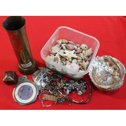 272 - A small box of shells, costume jewellery and a trench art shell