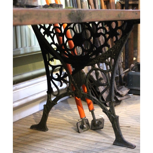 32 - A low garden table on cast iron legs