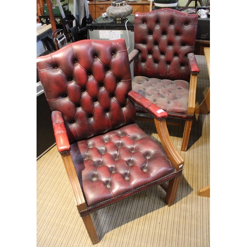 95 - A pair of red leather chesterfield style carver armchairs