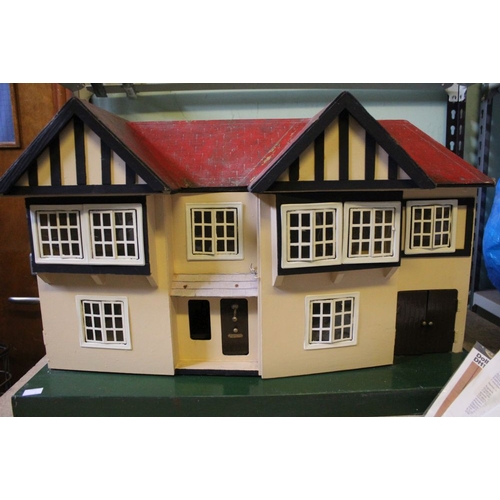 196 - A mid 20th century Triang manufactured dolls house to include furniture and associated literature