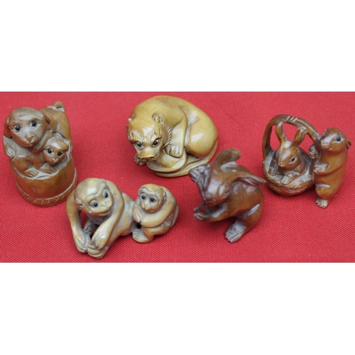 22 - A collection of five Japanese carved wood Netsuke, all as animals, includes Monkey's, Hare's, Temple... 