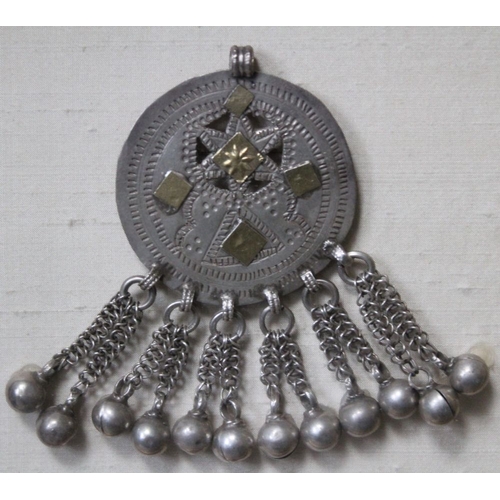 41 - A white metal Arabian hair ornament, worn by girls in Southern Oman, designed as a disc with yellow ... 