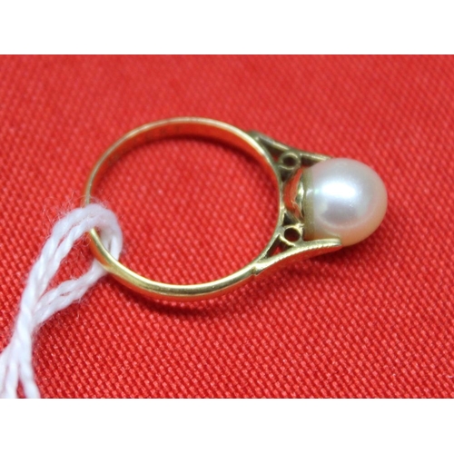 45 - An 18ct gold ring set a solitaire pearl, together with a graduated single strand pearl necklace (2)