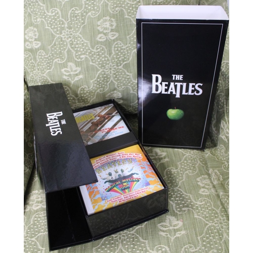 46 - The Beatles, the original Studio Recordings digitally remastered in stereo, in an Apple box, the ind... 