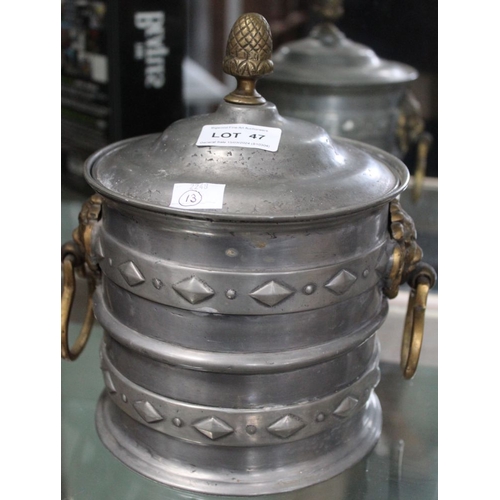 47 - A pewter ice bucket, fitted brass Lion mask handles, with an acorn finial to the lid, touchmarks to ... 