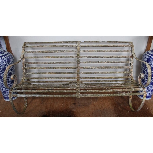 58 - A probable Victorian well weathered strap iron garden bench with plaque stating supplied from Lacey'... 