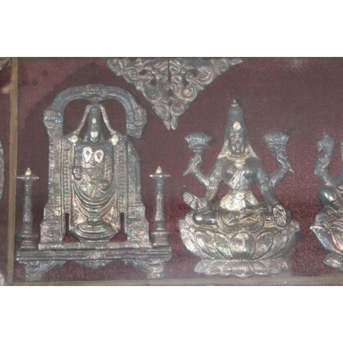 59 - An Indian white metal frieze, depicts Ganesh to the centre, 29cm x 78cm, framed and glazed