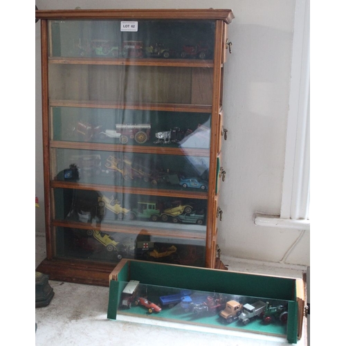 62 - An early 20th century purpose built six drawer glazed front display cabinet, containing a good selec... 