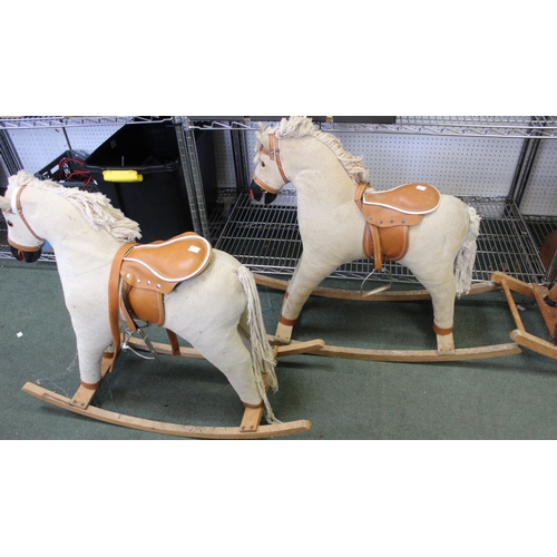 80 - A pair of cream cord Rocking Horses