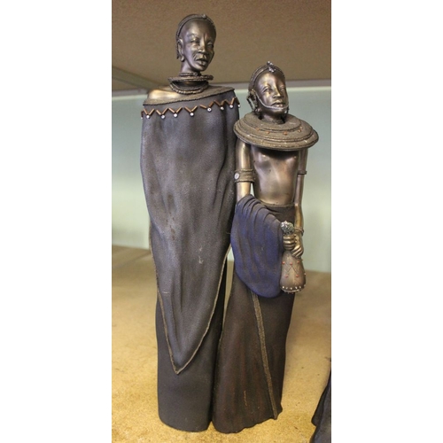 145 - Two Maasai figures of women from the Leonardo Collection, together with another example of a Maasai ... 