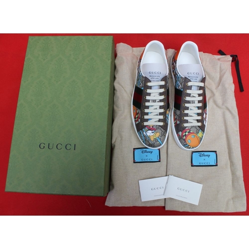 153 - A pair of Gucci Donald Duck trainers, boxed, size 71/2 

The sole has a 7.5 sticker on the sole, but... 