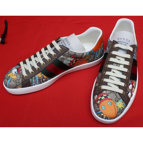 153 - A pair of Gucci Donald Duck trainers, boxed, size 71/2 

The sole has a 7.5 sticker on the sole, but... 