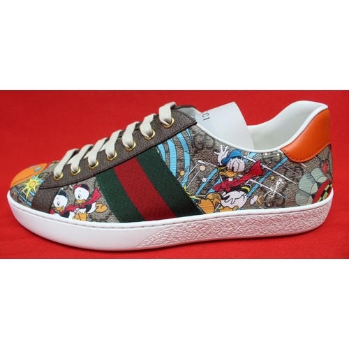 153 - A pair of Gucci Donald Duck trainers, boxed, size 71/2 

The sole has a 7.5 sticker on the sole, but... 