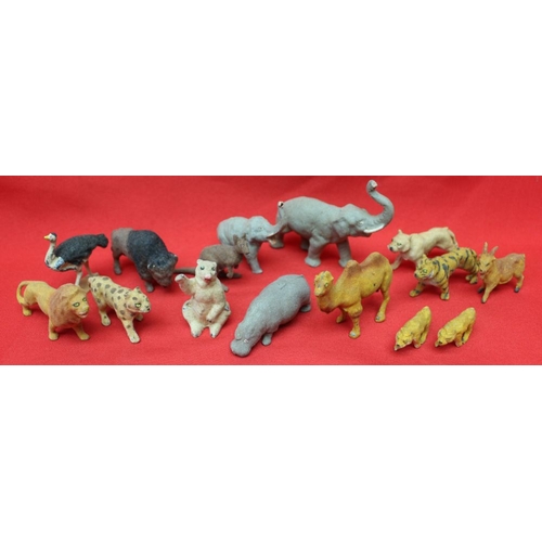 167 - A collection of cast metal wild animals with a plush finish, comprising elephant, polar bear, lion, ... 