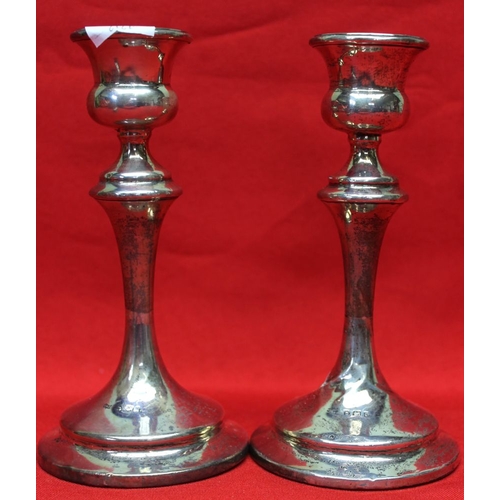 171 - A collection of hallmarked silver items, includes a pair of silver candlesticks, a cut glass grenade... 