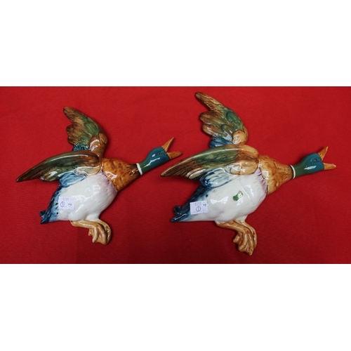 184 - A set of four Beswick pottery flying duck wall ornaments, No.596-1,2,3 and 4, three still bear the l... 