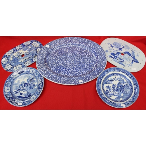 185 - A quantity of blue and white transfer decorated wares, including a meat dish, 