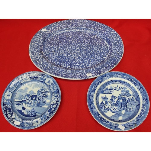 185 - A quantity of blue and white transfer decorated wares, including a meat dish, 