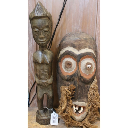 187 - A mid-century African carved figure & mask