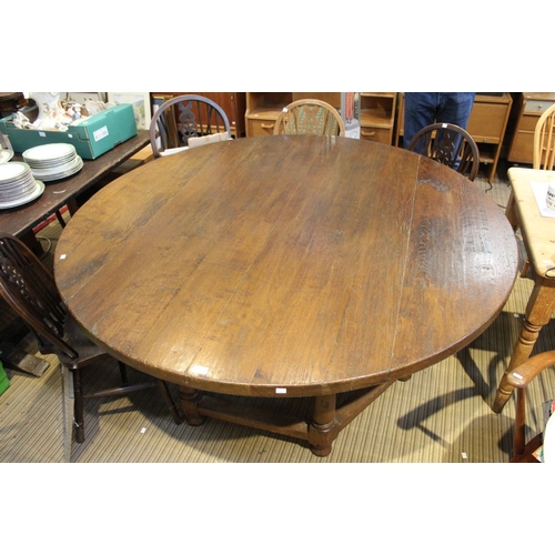 220 - A large 20th century oak round table on a substantial hexagonal base 167cm diam. 4.5cm depth of top ... 