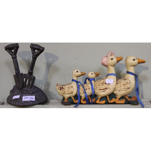 238 - Two cast metal doorstops one in the form of a family of geese