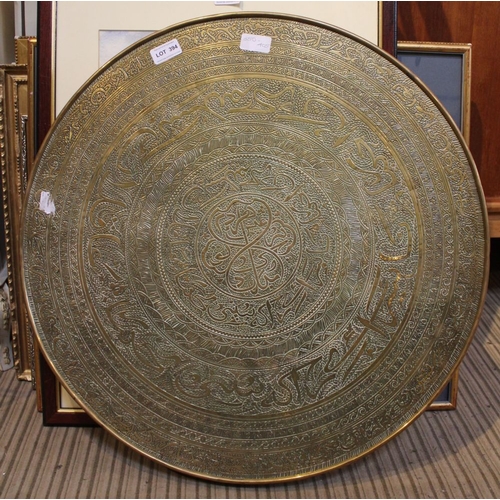 394 - A reverse topped Middle Eastern MOSQ circular brass table top with games table to the underneath