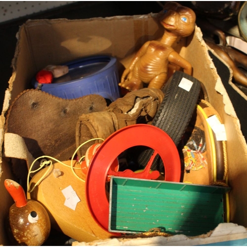 62 - A box containing a quantity of vintage children's toys, ET, metal vehicles, a pull along duck, etc