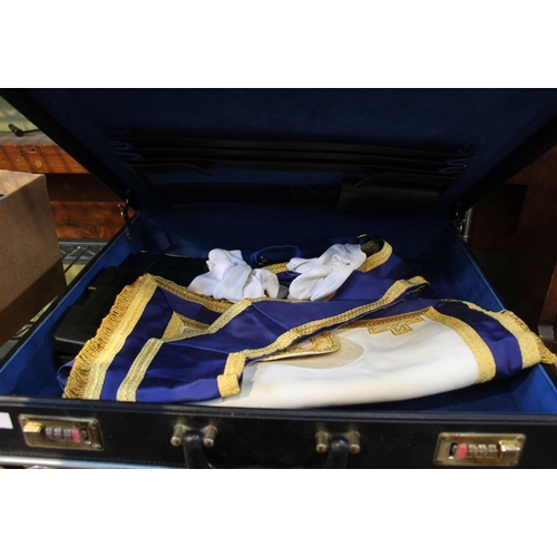 78 - A black briefcase containing a selection of Masonic regalia