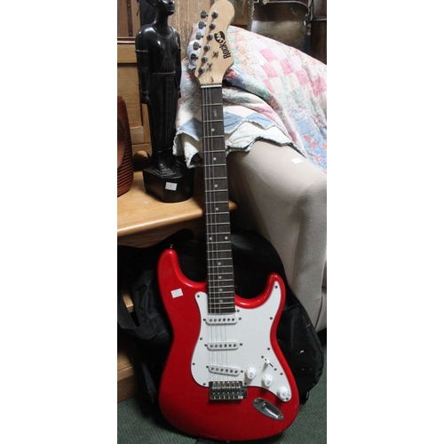 131 - A Rockjam electric guitar finished in red, together with a Rockjam 10W amp