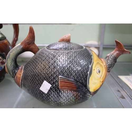 133 - A late 19th century teapot modelled as a fish, consuming a smaller fish