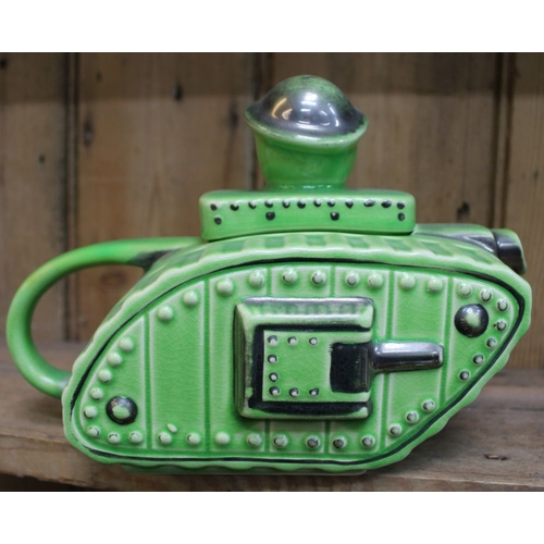 135 - A ceramic teapot modelled as a First World War tank, the lid knop in the form of an 