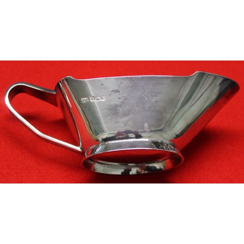 18 - A silver sauce boat and a set of silver coffee spoons, total weight: 189g