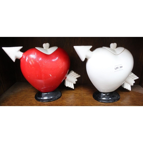 181 - Two pottery pierced heart ceramic teapots, one painted red (2)