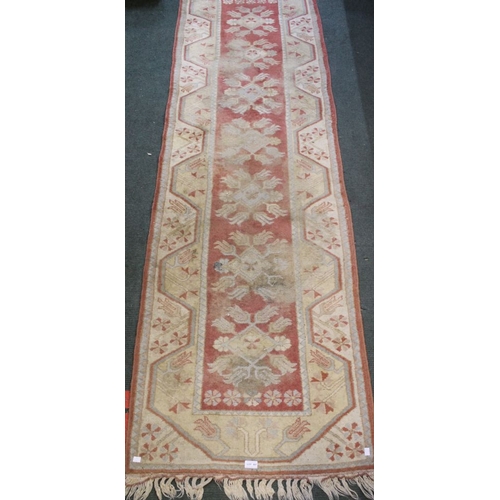 189 - A machine woven floral geometric patterned hall runner, 76cm x 266cm