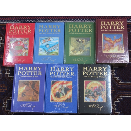 201 - Harry Potter J.K.Rowling A Complete set of the de-luxe editions the 7 volumes are all in shrink wrap... 