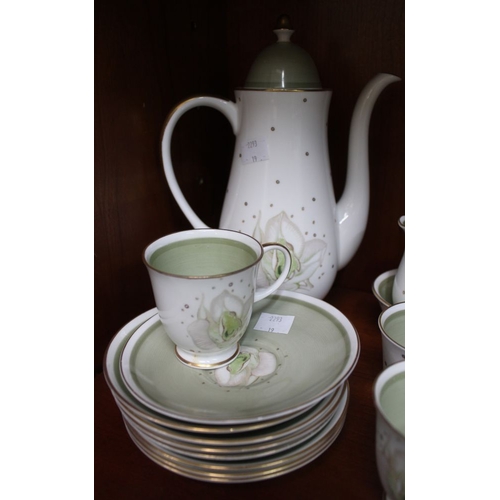 216 - A Susie Cooper coffee service, almond green floral design, gilded, comprising coffee pot, sugar bowl... 