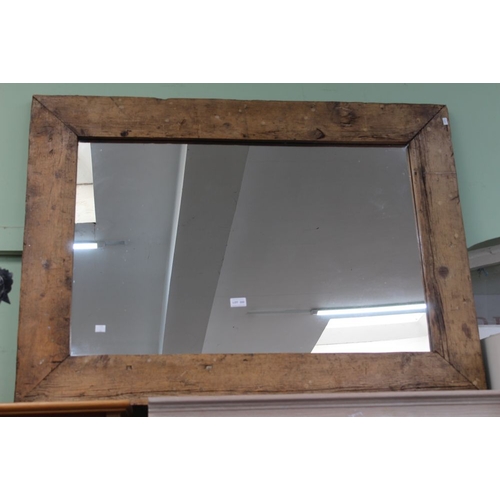 222 - A large wall mirror with rustic pine frame