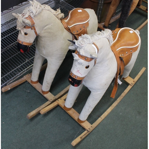 233 - A pair of cream cord Rocking Horses