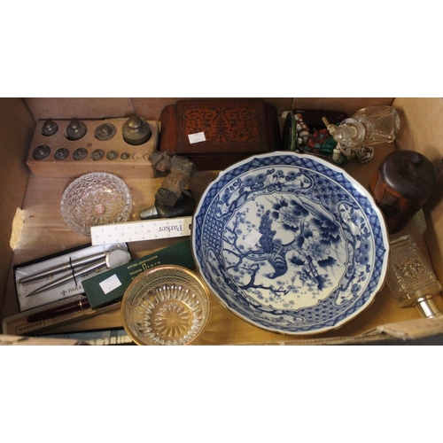 24 - A box containing a selection of vintage collectibles to include pens, blue and white china, brass we... 