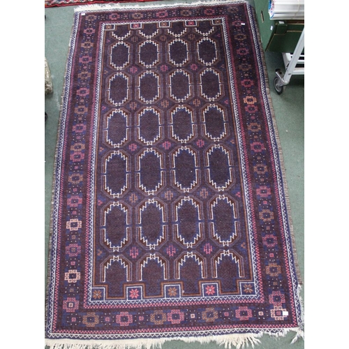 278 - A large floor rug, plum ground geometric pattern, 200cm x 160cm