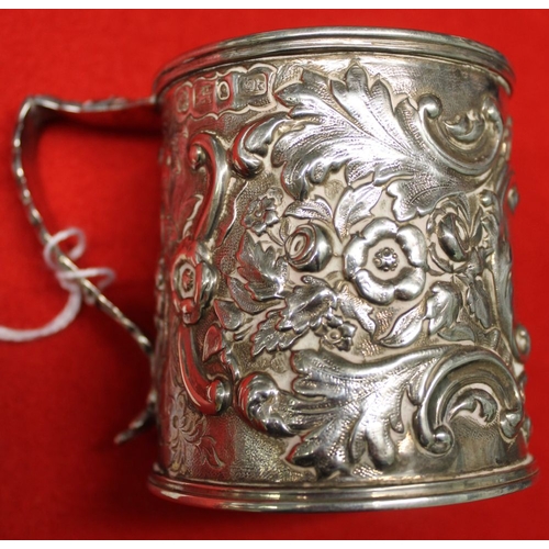 3 - A Victorian silver christening mug, embossed floral decoration, blind cartouche, Sheffield 1853, 126... 