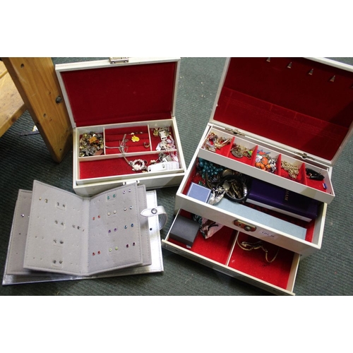 30 - A good selection of costume jewellery, housed in two boxes,  & an earring book