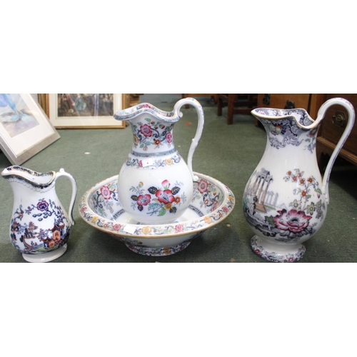 31 - A late Victorian pottery water jug and bowl, hand coloured floral decoration, together with two othe... 